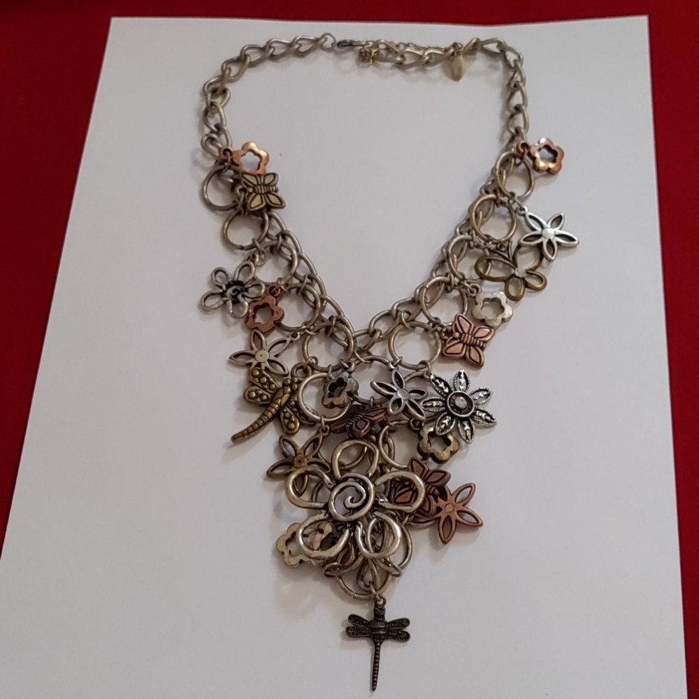 Metal necklace with multiple charms